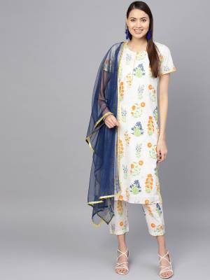 For Your Semi-Casual Wear, Grab This Readymade Printed Suit In White And Navy Blue Color. Its Top And Bottom Are Cotton Based Paired With Net Fabricated Dupatta. Buy Now.