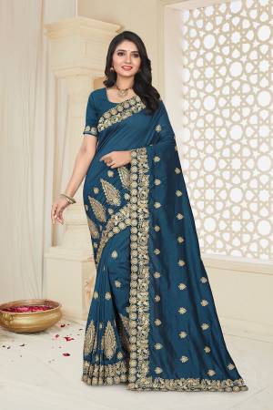 Grab This Designer Saree For The Upcoming Festive And Wedding Season In Prussian Blue Color. This Saree And Blouse Are Fabricated on Art Silk Beautified With Jari Embroidery. 
