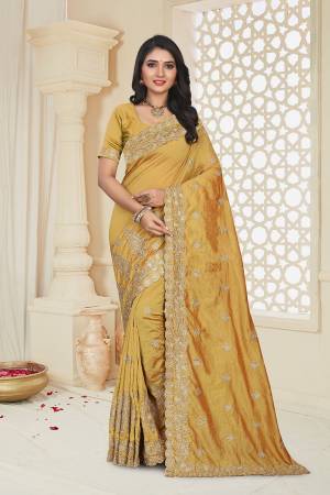 For A Rich And Elegant Look, Grab This Designer Embroidered Saree In Occur Yellow Color. This Saree And Blouse Are Silk Based Beautified With Attractive Jari Embroidery. Buy Now.
