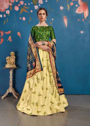 For The Upcoming Festive And Wedding Season, Here Is A Perfect Designer Lehenga Choli In Dark Green Colored Blouse Paired With Yellow Colored Lehenga And Multi Colored Dupatta. This Lehenga Choli Is Silk Based Paired With Tussar Art Silk Fabricated Dupatta. It Pretty Digital Prints Will Earn You Lots Of Compliments From onlookers. 