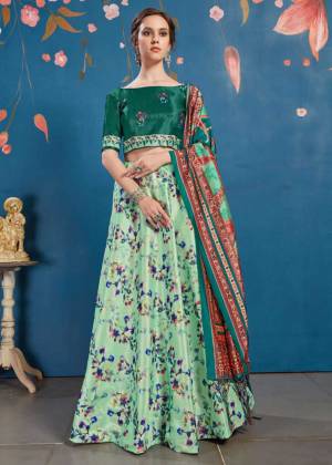 Go Colorful With This Lovely Designer Lehenga Choli In Teal Green Colored Blouse Paired With Contrasting Light Green Colored lehenga And Teal Green Colored Dupatta. Its Blouse And Lehenga Are Fabricated On Art Silk Paired With Tussar Art Silk Fabricated Dupatta. It Is Beautified With Lovely Digital Prints. Buy Now.