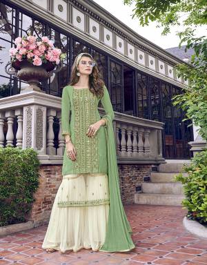 Grab This Beautiful Designer Sharara Suit In Light Green Colored Top Paired With Off-White Colored Sharara And Light Green colored Dupatta. Its Top IS Fabricated On Satin Silk With Embroidered Net Inner. Its Sharara IS Fabricated On Georgette Paired With Chiffon Dupatta. 