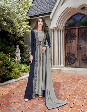 Rich And Elegant Looking Designer Indo-Western Dress Is Here In Grey And Navy Blue Color. Its Blouse, Bottom And Jacket Are Fabricated On Crepe Paired With Chiffon Fabricated Dupatta. 