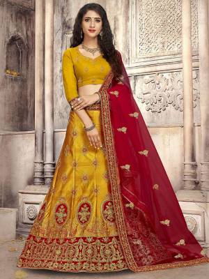 Look The Most Gorgeous Of All This Wedding Season With This Heavy Designer Lehenga Choli In Musturd Yellow Color Paired With Contrasting Red Colored Dupatta. Its Blouse Is Fabricated on Art Silk Paired With Satin Silk Lehenga And Net Fabricated Dupatta. Buy This Semi-Stitched Lehenga Choli Now.