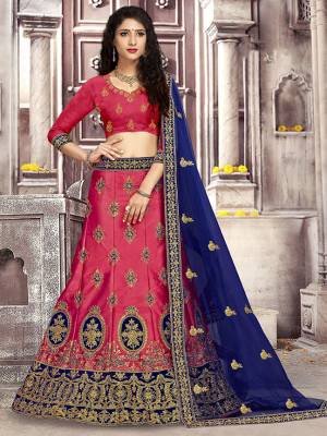 Look The Most Gorgeous Of All This Wedding Season With This Heavy Designer Lehenga Choli In Dark Pink Color Paired With Contrasting Royal Blue Colored Dupatta. Its Blouse Is Fabricated on Art Silk Paired With Satin Silk Lehenga And Net Fabricated Dupatta. Buy This Semi-Stitched Lehenga Choli Now.