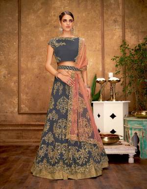 Splurge of unparalleled star-like style, pattern and colors, this lehenga accessorized stylishly with an embroidered belt exudes a pretty exclusive vibe . 