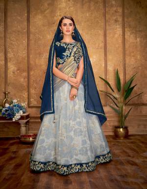 The abstract musings in a delightful combinations just became real in this fancy jacquard lehenga with  double dupatta for you to give your look the much-desired versatality. 