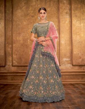 The unique craftsmanship  in this precisely embroidered lehenga imbues it with conventional and modern features alike. The frills add on to the modern outlook while the touch of gold gives it a classy appeal. 