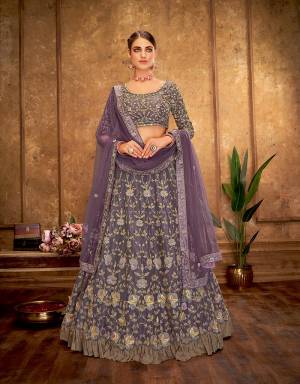 The purple gleams and golden sheens is a tribute to modern beauty and style. With delicate floral embroidery and crushed frill details, this lehenga is a princessy pick for your special day. 