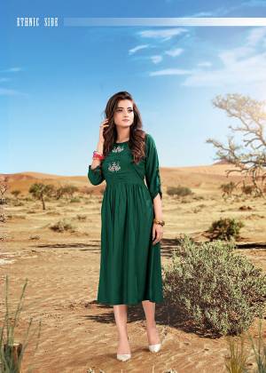 Here Is A Beautiful Readymade Kurti In Pine Green Color Fabricated On Rayon. This Kurti Has Minimal Thread Work Over The Yoke. It Is Light Weight And Easy To Carry All Day Long. 