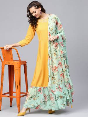 Grab This Designer Readymade Long Kurti In Musturd Yellow Color Paired With A Very Pretty Light Green Colored Dupatta. This Kurti Is Fabricated on Crepe Paired With Georgette Fabricated Floral Printed Dupatta. 