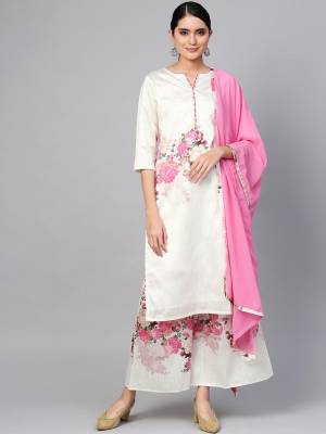 Look Pretty In This Beautiful Readymade Designer Suit In White Color Paired With Pink Colored Dupatta. Its Top And Bottom Are Silk Based Beautified With Floral Prints Paired With Georgette Fabricated Dupatta. 