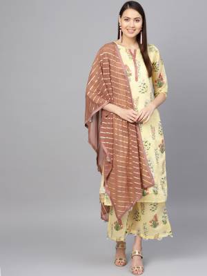 Look Pretty In This Beautiful Readymade Designer Suit In Light Yellow Color Paired With Brown Colored Dupatta. Its Top And Bottom Are Chanderi Based Beautified With Floral Prints Paired With Georgette Fabricated Dupatta. 