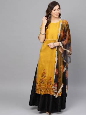 Add This Beautiful Readymade Suit To Your Wardrobe In Musturd Yellow Colored Top Paired With Black Colored Bottom And Dupatta. Its Top And Bottom Are Fabricated On Poly Silk Paired With Net Fabricated Dupatta. 