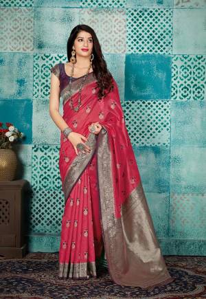 Grab This Beautiful Designer Silk Based Saree In Pink Color Paired With Contrasting Wine Colored Blouse. This Saree And Blouse Are Fabricated On Banarasi Art Silk Beautified With Weave All Over. 