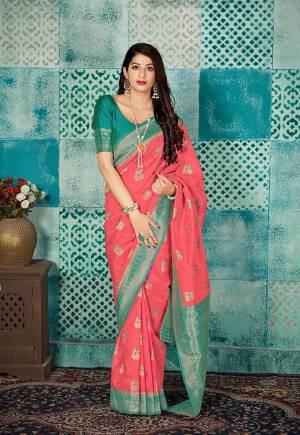Grab This Beautiful Designer Silk Based Saree In Dark Peach Color Paired With Contrasting Sea Green Colored Blouse. This Saree And Blouse Are Fabricated On Banarasi Art Silk Beautified With Weave All Over. 