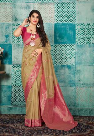 Grab This Beautiful Designer Silk Based Saree In Beige Color Paired With Contrasting Dark Pink Colored Blouse. This Saree And Blouse Are Fabricated On Banarasi Art Silk Beautified With Weave All Over. 