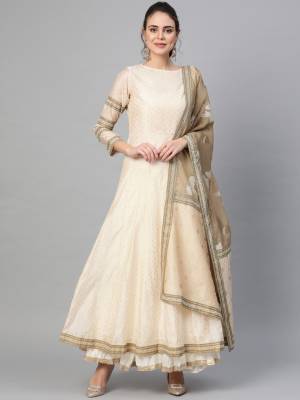 Celebrate This Festive Season With Beauty And Comfort Wearing This Designer A-Line Suit In Cream Color. Its Top Is Fabricated On Chanderi Paired With Art Silk Fabricated Dupatta. Buy This Rich And Elegant Looking Suit Now.