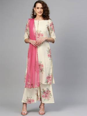 Simple And Elegant Looking Readymade Suit Is Here In Off-White Colored Top and Bottom Paired With Pink Colored Dupatta. The Lovelt Floral Printed Top and Bottom Are Crepe Based Paired With Net Fabricated Dupatta. 