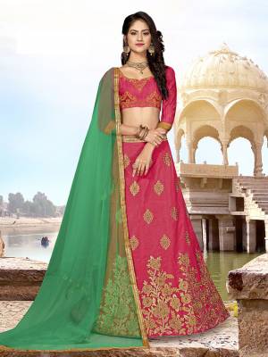 Grab This Designer Silk Based Lehenga Choli In Dark Pink Color Paired With Contrasting Green colored Blouse. Its Blouse And Lehenga Are Fabricated on Art Silk Paired With Net Fabricated Dupatta. Buy Now. 