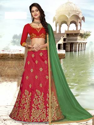 Grab This Designer Silk Based Lehenga Choli In Red Color Paired With Contrasting Green colored Blouse. Its Blouse And Lehenga Are Fabricated on Art Silk Paired With Net Fabricated Dupatta. Buy Now. 