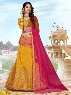 Grab This Designer Silk Based Lehenga Choli In Musturd Yellow Color Paired With Contrasting Rani Pink colored Blouse. Its Blouse And Lehenga Are Fabricated on Art Silk Paired With Net Fabricated Dupatta. Buy Now. 