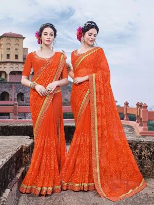 Shine Bright Wearing This Heavy Designer Saree In Orange Color Paired With Orange Colored Blouse. This Pretty Saree Is Georgette Based Beautified With Tone To Tone Embroidery Paired With Art Silk Fabricated Blouse. 