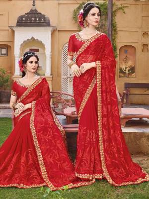 Adorn The Pretty Angelic Look Wearing This Heavy Designer Red Colored Saree Paired With Red Colored Blouse. This Saree Is Fabricated On Georgette Paired With Art Silk Fabricated Blouse. It Embroidery And Color Gives An Attractive Look To Your Personality. 