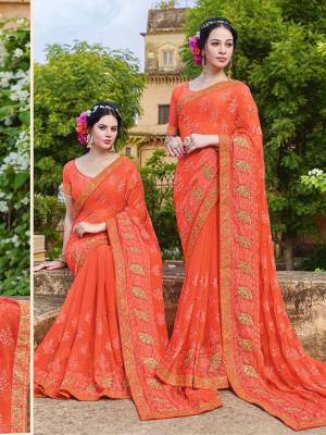 Grab This Heavy Designer Saree In Orange Color Paired With Orange Colored Blouse. This Heavy Embroidered Saree Is Fabricated On Georgette Paired With Art Silk Fabricated Blouse. It Is Easy To Drape And Carry All Day Long. 