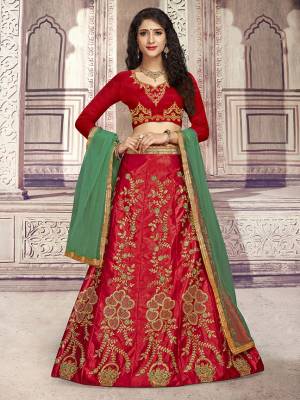 Here Is A Heavy Designer Lehenga Choli In Red Color Paired With Contrasting Green Colored Dupatta. Its Blouse Is Fabricated On Art Silk Paired With Satin Silk Fabricated Lehenga And Net Dupatta. Its Pretty Blouse And Lehenga Are Beautified With Embroidery Which Comes With A Net Dupatta With Lace Border. Buy Now.