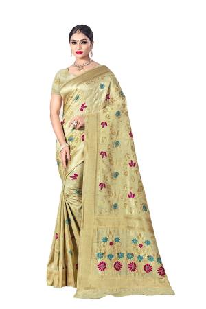 Here Is A Royal Looking Designer Silk Based Saree In Cream Color. This Saree Is Fabricated on Banarasi Art Silk Paired With Art Silk Fabricated Blouse. Its Color And Rich Fabric Will Earn You Lots Of Compliments From Onlookers. 