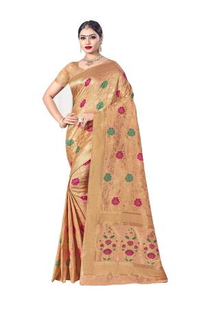 Here Is A Royal Looking Designer Silk Based Saree In Light Orange Color. This Saree Is Fabricated on Banarasi Art Silk Paired With Art Silk Fabricated Blouse. Its Color And Rich Fabric Will Earn You Lots Of Compliments From Onlookers. 