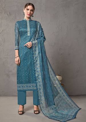 Here Is A Deisgner Straight Suit In Blue Kota Checks Pattern. Its Top And Dupatta Are Cotton Silk Based Paired With Cotton Fabricated Bottom. It Is Beautified With Prints Which Makes Easy And Comfortable To Carry All Day Long. 