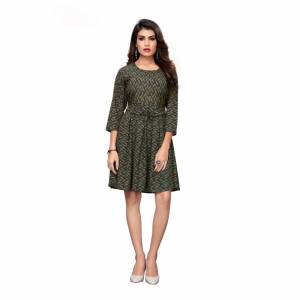 Grab This Lovely Readymade One Piece In Dark Green Color Fabricated on Crepe. It Is Beautified With Prints Giving A Cute Look The Dress. Also It Is Light Weight, And Its Fabric Is Soft Towards Skin Which Is Easy To Carry All Day Long. 