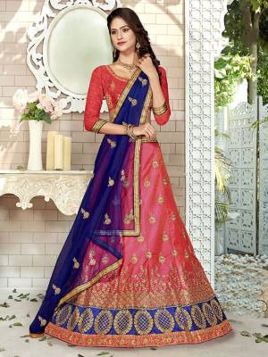 For A Proper Traditional Look, Grab This Heavy Designer Lehenga Choli In Dark Pink Color Paired With Contrasting Royal Blue Colored Blouse. Its Blouse Is Fabricated On Art Silk Paired With Satin Silk Lehenga And Net Fabricated Dupatta. It Is Beautified With Attractive Embroidery. Buy This Pretty Piece Now.