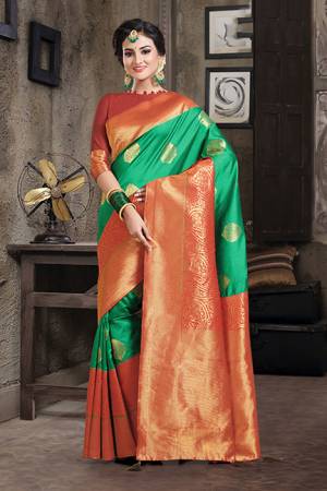 Grab This Designer Silk Based Saree In Green Color Paired With Red Colored Blouse. This Saree And Blouse Are Fabricated On Art Silk Beautified With Weave All Over. Buy Now.