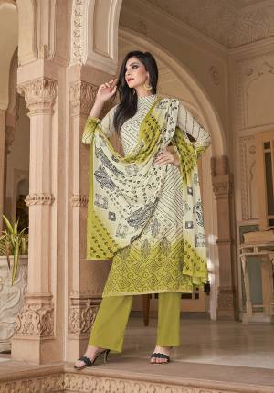 Simple And Elegant Looking Printed Suit Is Here In Off-White And Pear Green Color. This Pretty Suit Is Cotton Based Which Is Soft Towards Skin, Durable And Easy To Carry All Day Long. Buy This Pretty Semi-Casual Wear Suit Now.