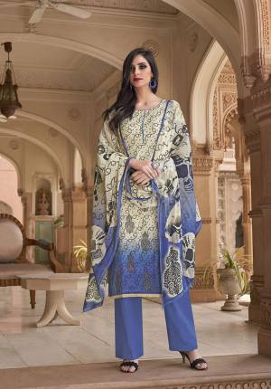 Simple And Elegant Looking Printed Suit Is Here In Off-White And Blue Color. This Pretty Suit Is Cotton Based Which Is Soft Towards Skin, Durable And Easy To Carry All Day Long. Buy This Pretty Semi-Casual Wear Suit Now.