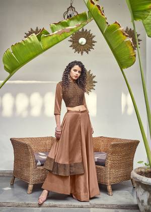You Will Definitely Earn Lots Of Compliments Wearing This Designer Readymade Pair In Brown Color. Its Top Is Fabricated on Jacquard Silk Paired With Soft Silk Fabricated Skirt. 