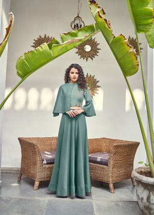 New Shade Is Here To add Into Your Wardrobe With A New And Unique Color Shade In Dusty Green. This Readymade Pair Of Crop Top And Skirt Are Silk Based With A Unqiue Asymetric pattern.  Buy Now.
