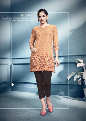 Add Some Casuals With This Readymade Short Kurti In Beige Color Fabricated On Crepe. It IS Beautified With Prints Which Is Light Weight And Easy To Carry All Day Long. 