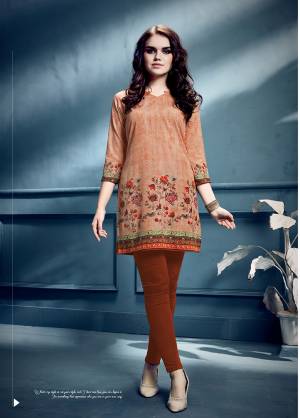 Add Some Casuals With This Readymade Short Kurti In Light Orange Color Fabricated On Crepe. It IS Beautified With Prints Which Is Light Weight And Easy To Carry All Day Long. 