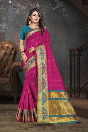 Here Is Proper Traditional Looking Designer Weaved Saree In Dark Pink?Color Paired With Contrasting Blue Colored Blouse. This Saree Is Fabricated on Cotton Paired With Art Silk Fabricated Blouse. It Is Light Weight And Easy To Carry All Day Long.