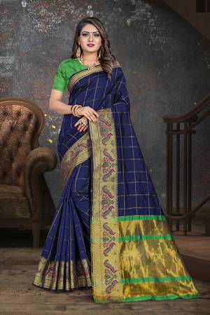 Adorn The Proper Angelic Look Wearing This Lovely Designer Weaved?Saree In Navy Blue Color Paired With Contrasting Green Colored Blouse. This Saree Is Fabricated On Cotton Paired With Art Silk Fabricated Blouse. Its Rich Fabric Will Give An Enahnced Look To Your Personality.