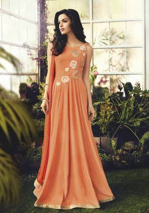Here Is A Beautiful Designer Floor Length Suit In Orange Color. ThisPretty Semi-Stitched Suit Is Cotton Based Beautified With Embroidery, It Is Light In Weight And Easy To Carry All Day Long. 