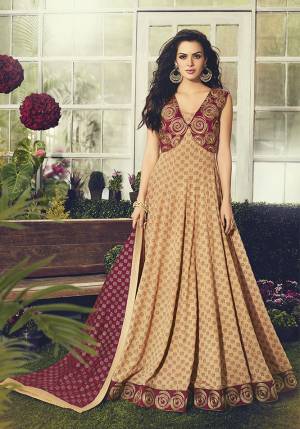 Get ready For The Upcoming Wedding And Festive Season With This Designer Floor Length Suit In Beige Color Paired With Maroon Colored Dupatta. This Suit Is Cotton Based Beautified With Detailed Embroidery.