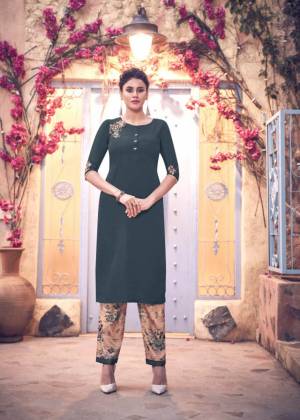 Add This Designer Readymade Kurti In Dark Grey Color Paired With beige Colored Digital Printed bottom. This Kurti IS Fabricated on Satin Silk Beautified With Hand Work. 