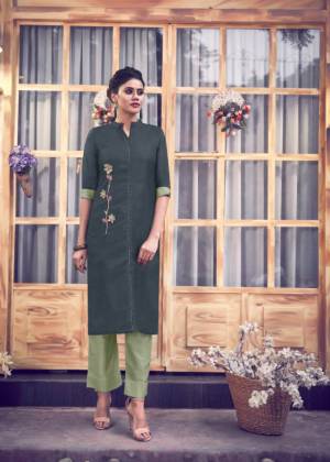 Here Is A Readymade Pair Of Kurti With Bottom In Dark Grey And Pastel Green Color Respectively. This Kurti IS Fabricated On Satin Silk Paired With Silk Blend Bottom. It Is Beautified With Hand Work. Buy Now.