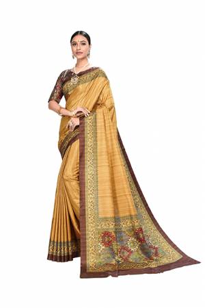 Add This Designer Saree In A Proper Traditional Look In Occur Yellow Color Paired With Brown Colored Blouse. This Saree And Blouse Are Dola Art Silk Based Beautified With Digital Prints. It Is Light Weight And Easy To Carry all Day Long. 