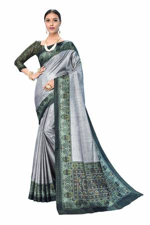 Add This Designer Saree In A Proper Traditional Look In Grey Color Paired With Multi Colored Blouse. This Saree And Blouse Are Dola Art Silk Based Beautified With Digital Prints. It Is Light Weight And Easy To Carry all Day Long. 